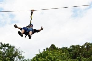 Man ziplining on Maui