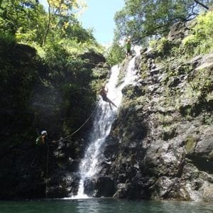Maui visitor rappelling down a waterfall