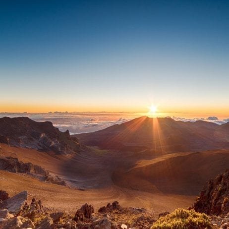 The breathtaking sunrise views over Haleakala summit on Maui helicopter tours.