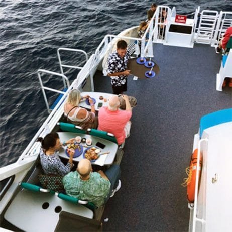 Enjoying Maui's local cuisine on Calypso Maalaea sunset dinner cruise.