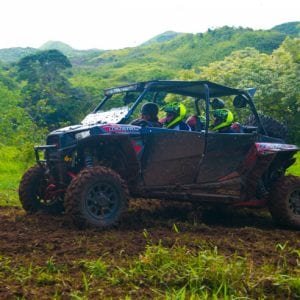 Maui off-road adventures taking guests on a tour in off-road vehicle.